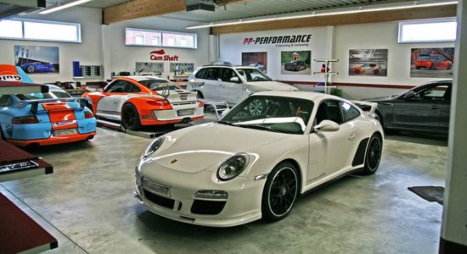 White Porsche inside a garage