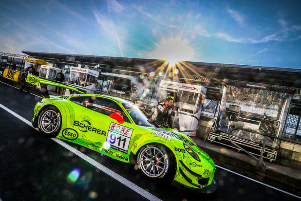 Fluorescent Porsche 911 GT3 R in the pitlane at the Nürburgring